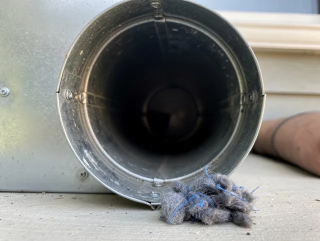 Temple City Dryer Vent Cleaning technician using specialized equipment to clear severe dryer vent blockage in Temple City